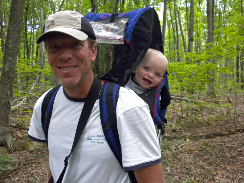 baby in a backpack at olson falls in munising, mi